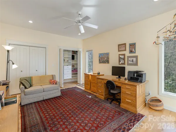 a living room with furniture and a rug