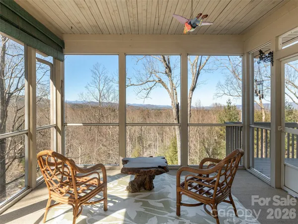 a balcony with furniture and wooden floor