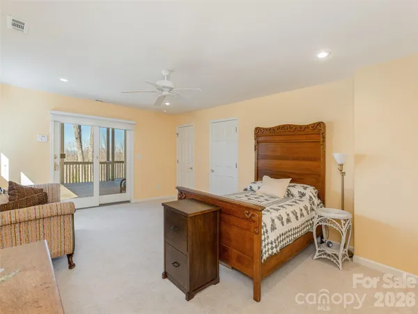 a bathroom with a granite countertop sink toilet a mirror and shower