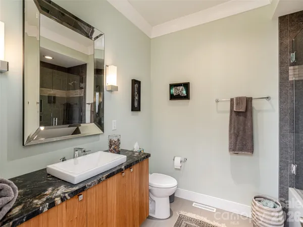 a bathroom with a bathtub and shower