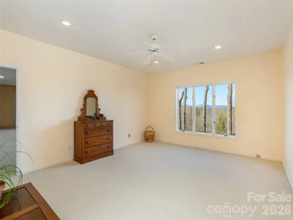 a bathroom with a granite countertop sink toilet a shower and a mirror