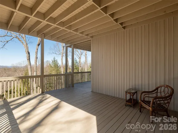 a view of balcony with wooden floor