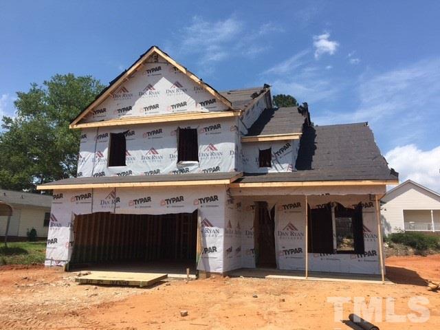 1509 Bentons Ridge Drive Raleigh, NC 27610 - Photo 1 of 23 a front view of a house with a yard