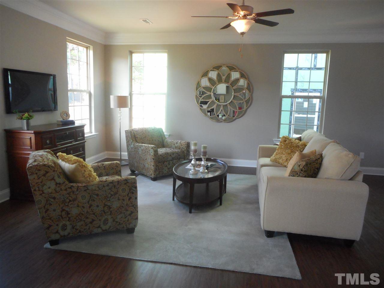 1509 Bentons Ridge Drive Raleigh, NC 27610 - Photo 3 of 23 a living room with furniture and a flat screen tv
