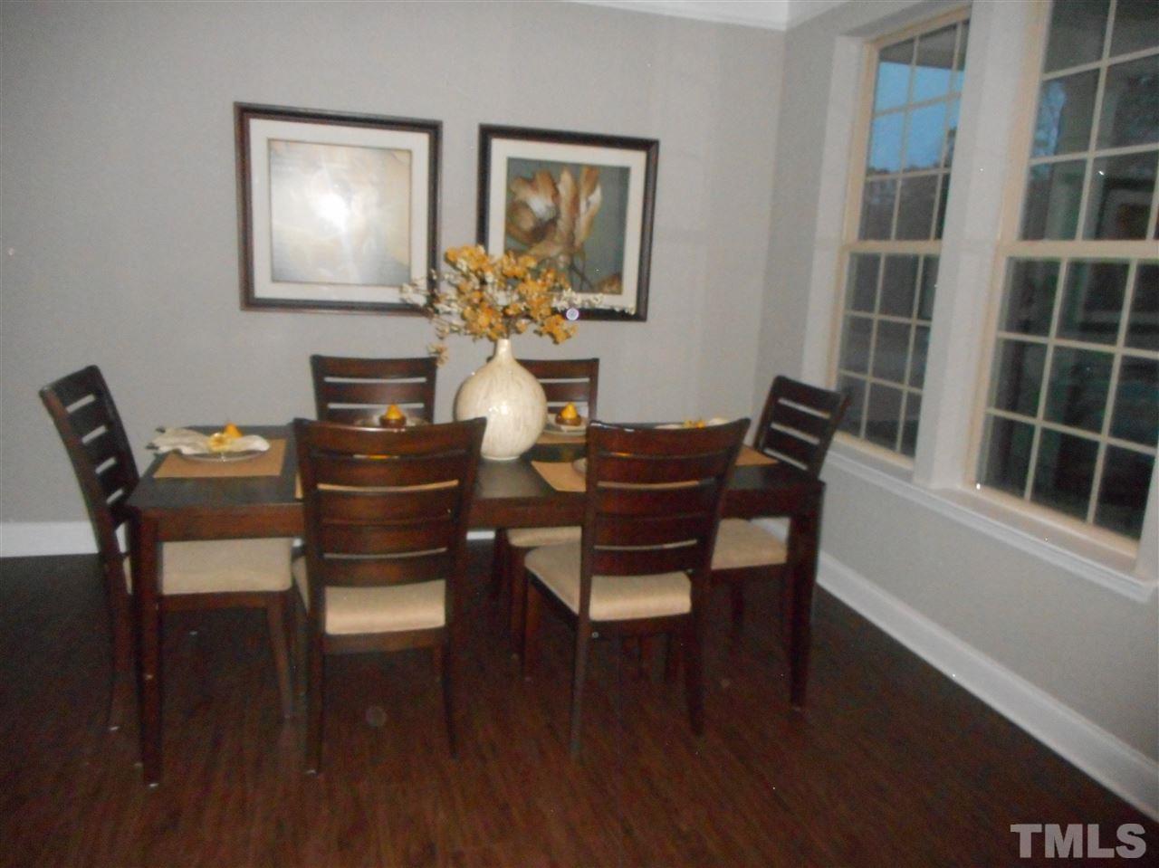 1509 Bentons Ridge Drive Raleigh, NC 27610 - Photo 5 of 23 a dining room with furniture and wooden floor
