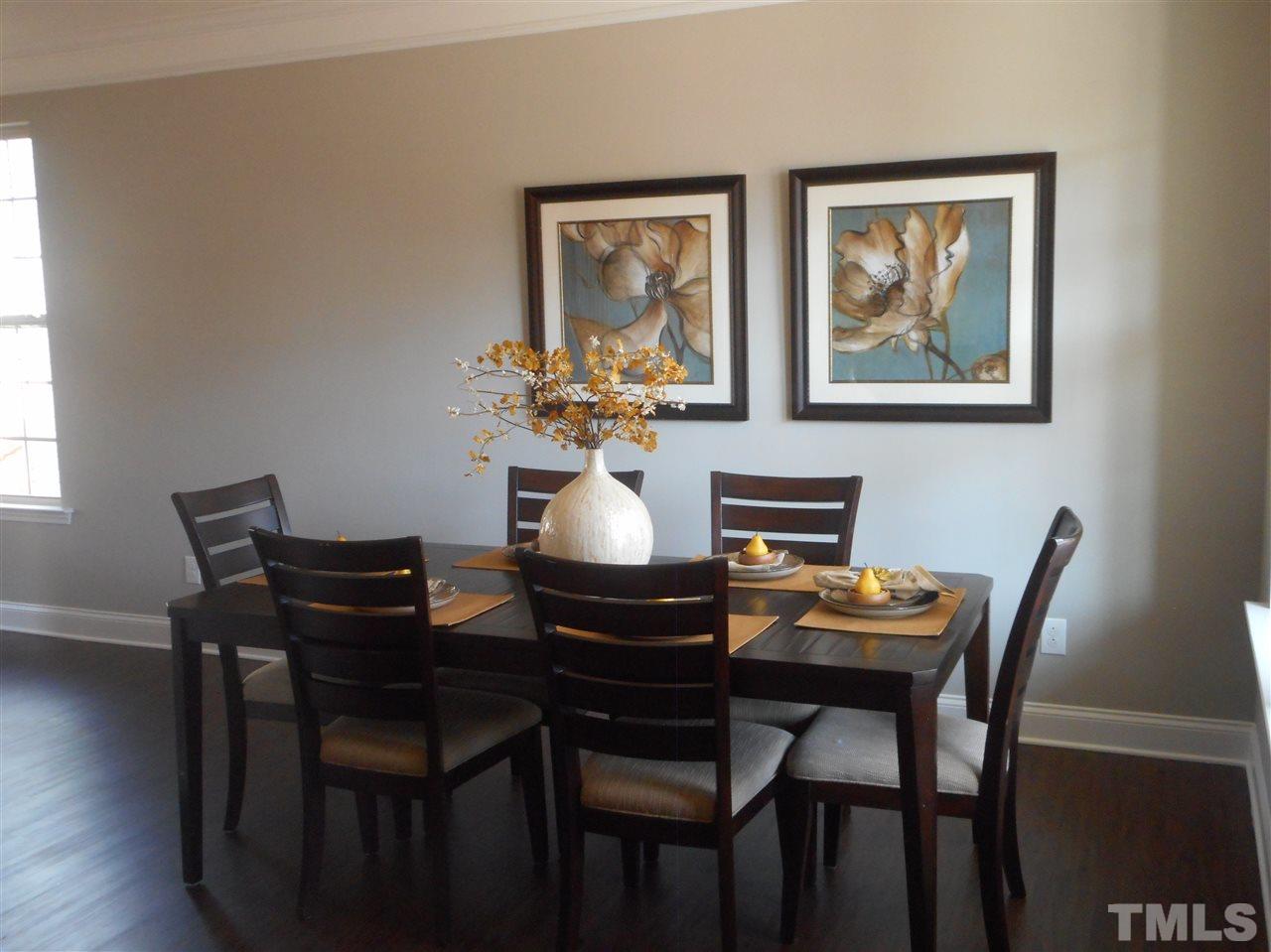 1509 Bentons Ridge Drive Raleigh, NC 27610 - Photo 7 of 23 a dining room with furniture and wooden floor