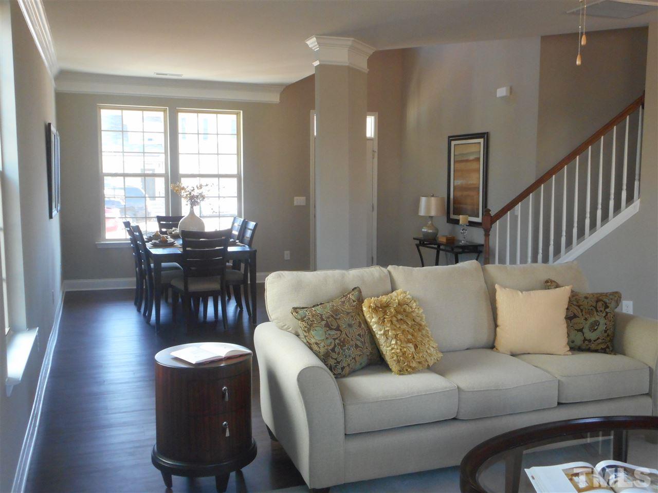 1509 Bentons Ridge Drive Raleigh, NC 27610 - Photo 8 of 23 a living room with furniture kitchen view and a large window