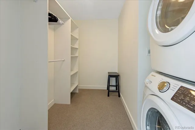 a view of storage and utility room with washer and dryer