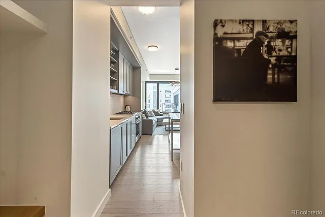 a hallway with a view of living room
