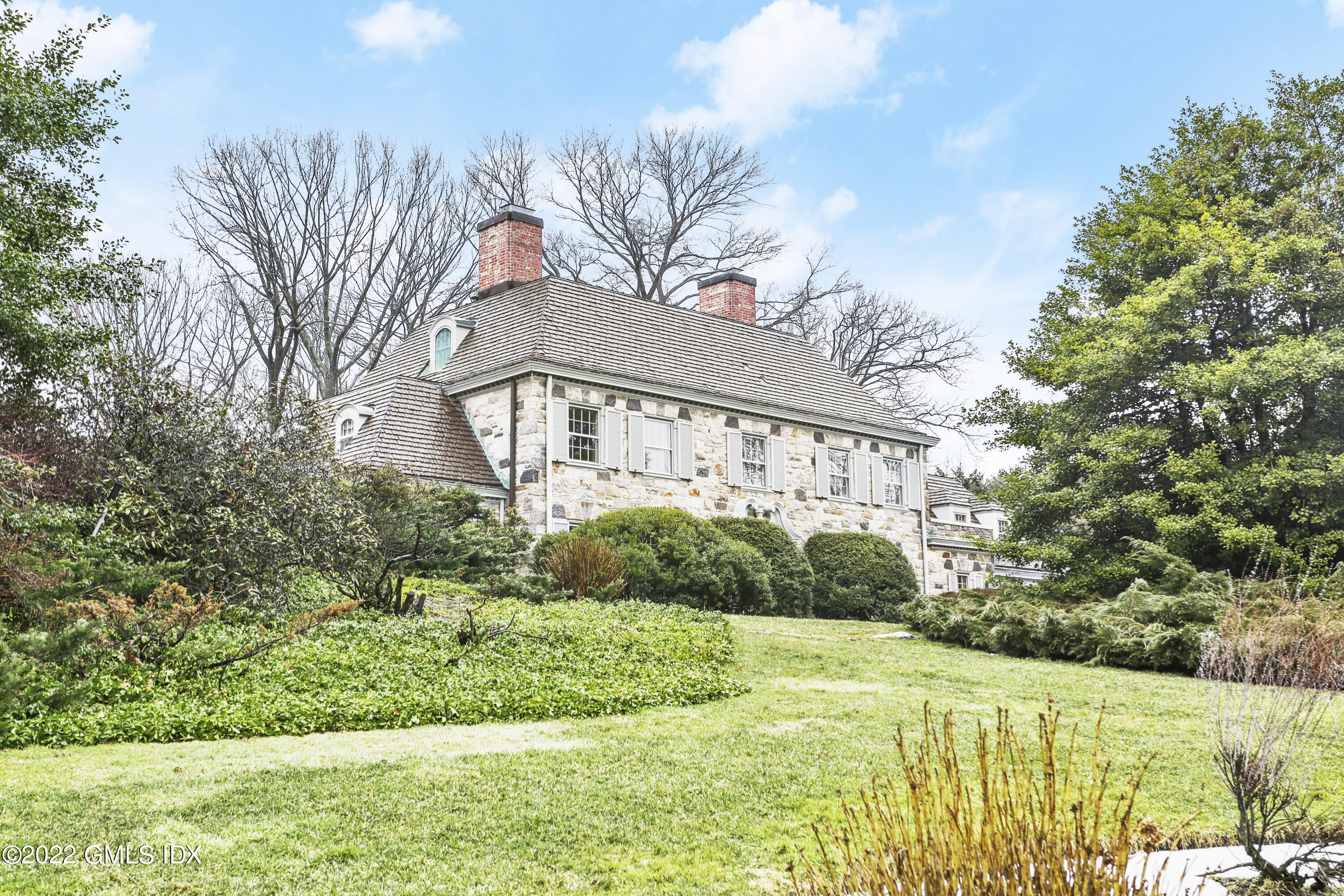34 Cathlow Drive Riverside, CT 06878 - Photo 1 of 14 a front view of house with yard and green space