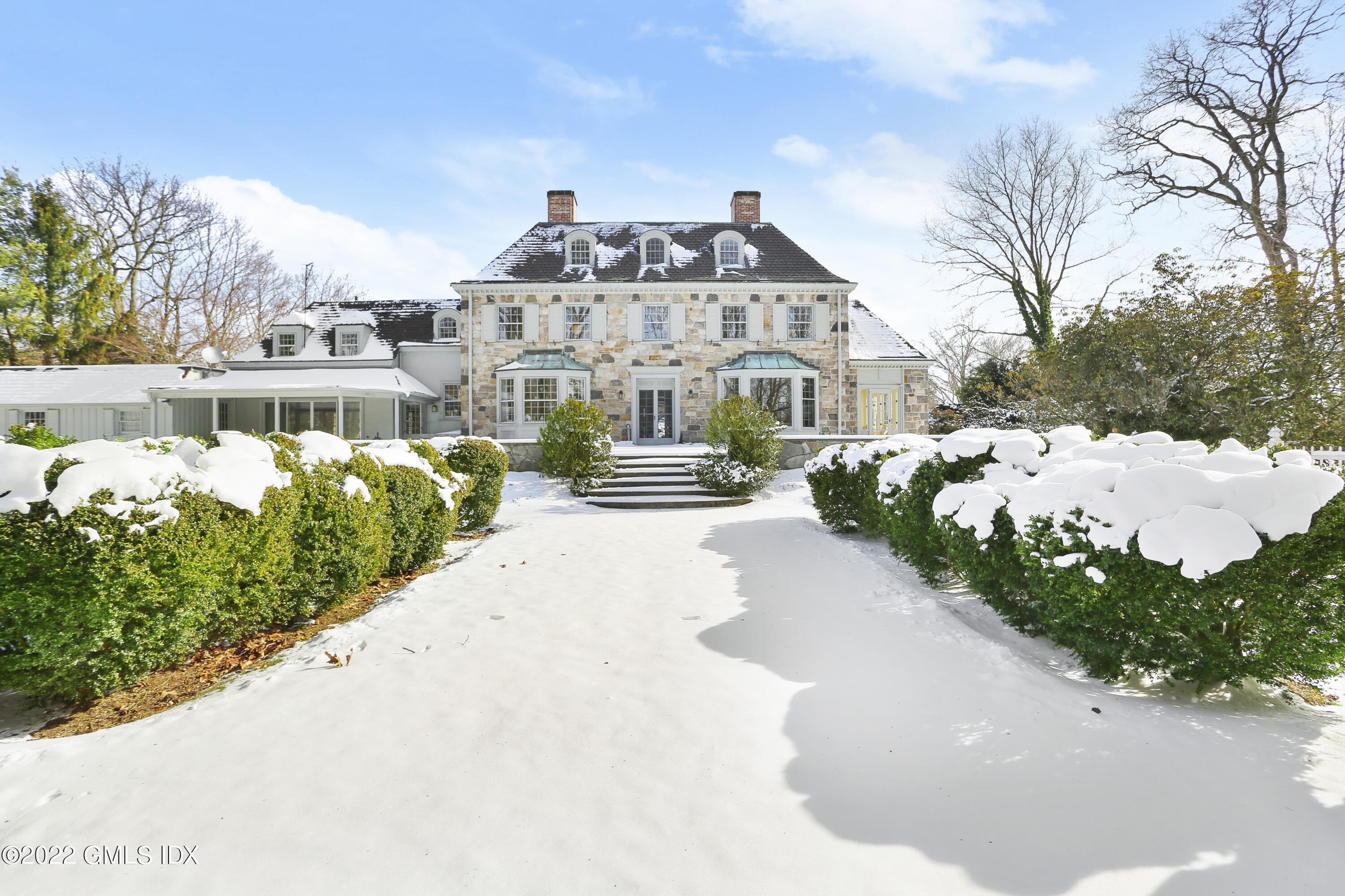 34 Cathlow Drive Riverside, CT 06878 - Photo 4 of 14 a front view of a house with a yard and fountain in middle