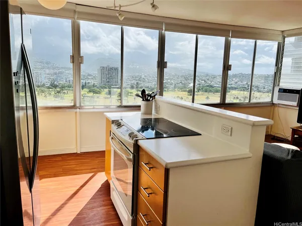 a view of a kitchen with a large window