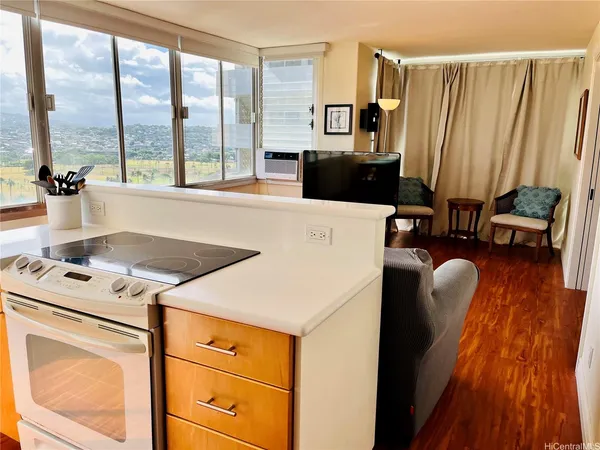 a kitchen with a stove a sink and a refrigerator