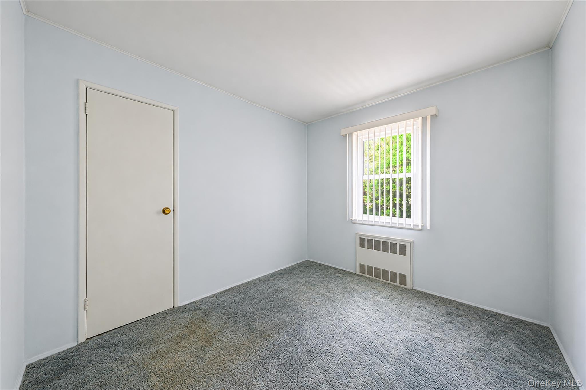 59 Maybrook Road North Babylon, NY 11703 - Photo 16 of 43 an empty room with windows