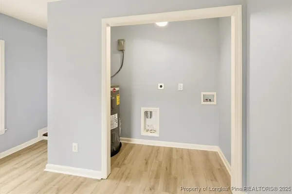 a bedroom with a bed couches and window