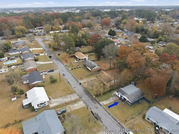 an aerial view of multiple houses with yard