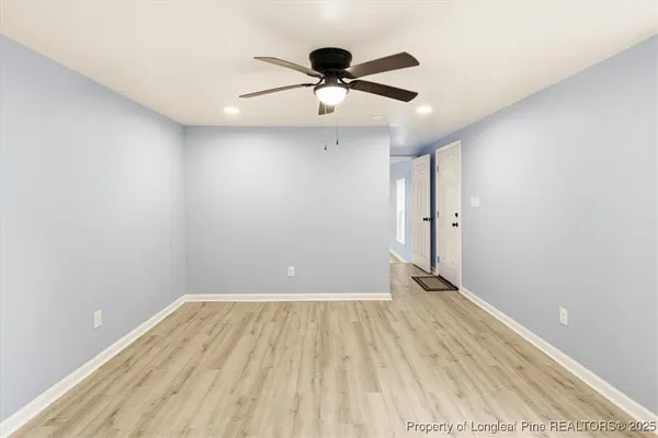 a bathroom with a sink mirror vanity and toilet
