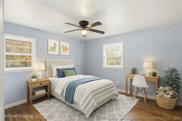 a view of a big room with carpet and windows