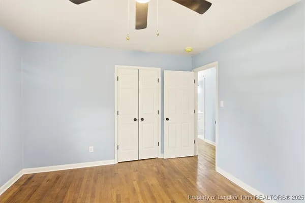 a bedroom with a bed and a potted plant