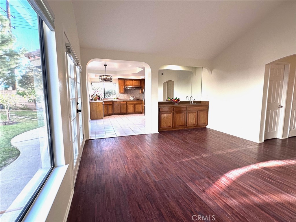 183 South Starflower Street Brea, CA 92821 - Photo 11 of 42 a hallway with wooden floor and furniture