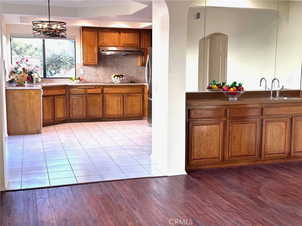 183 South Starflower Street Brea, CA 92821 - Photo 12 of 42 a kitchen with a sink and cabinets