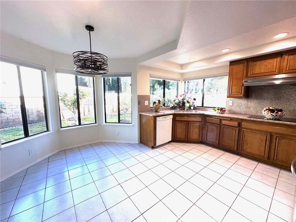 183 South Starflower Street Brea, CA 92821 - Photo 14 of 42 a kitchen with stainless steel appliances granite countertop a sink window and cabinets