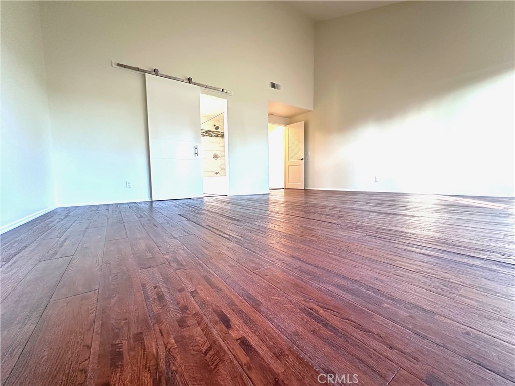 183 South Starflower Street Brea, CA 92821 - Photo 17 of 42 a view of an empty room and wooden floor