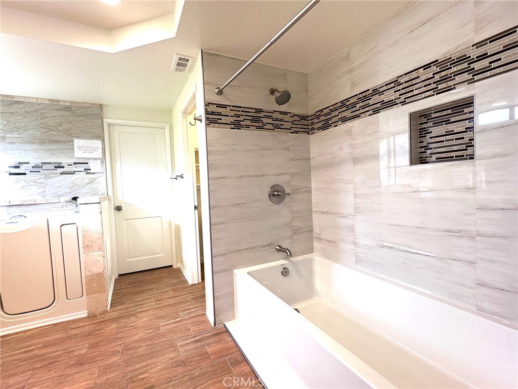 183 South Starflower Street Brea, CA 92821 - Photo 19 of 42 a bathroom with a bathtub and a shower