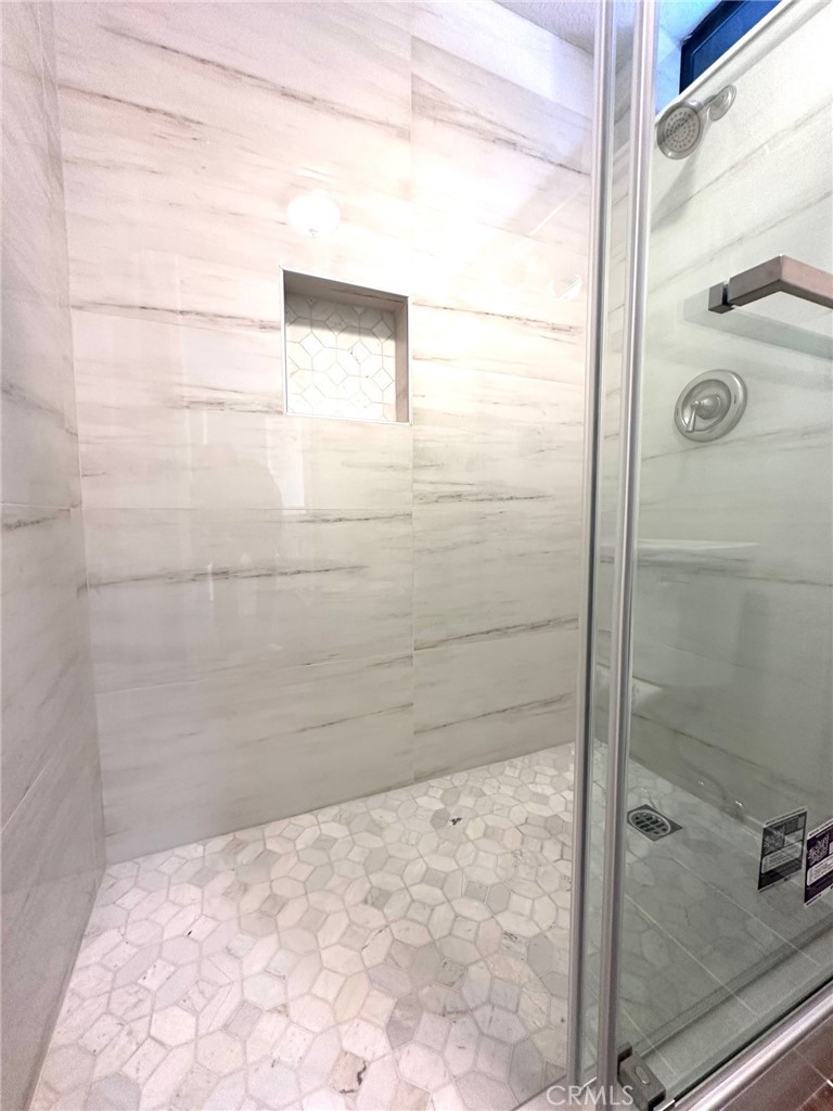 183 South Starflower Street Brea, CA 92821 - Photo 28 of 42 a bathroom with a shower