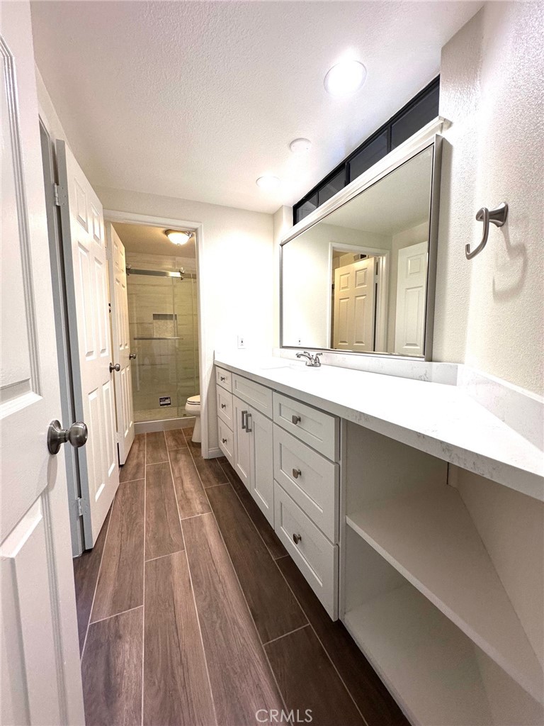 183 South Starflower Street Brea, CA 92821 - Photo 29 of 42 a spacious bathroom with a double vanity sink and a mirror