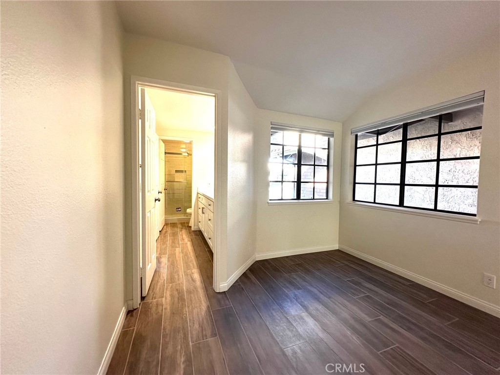 183 South Starflower Street Brea, CA 92821 - Photo 30 of 42 an empty room with wooden floor and windows
