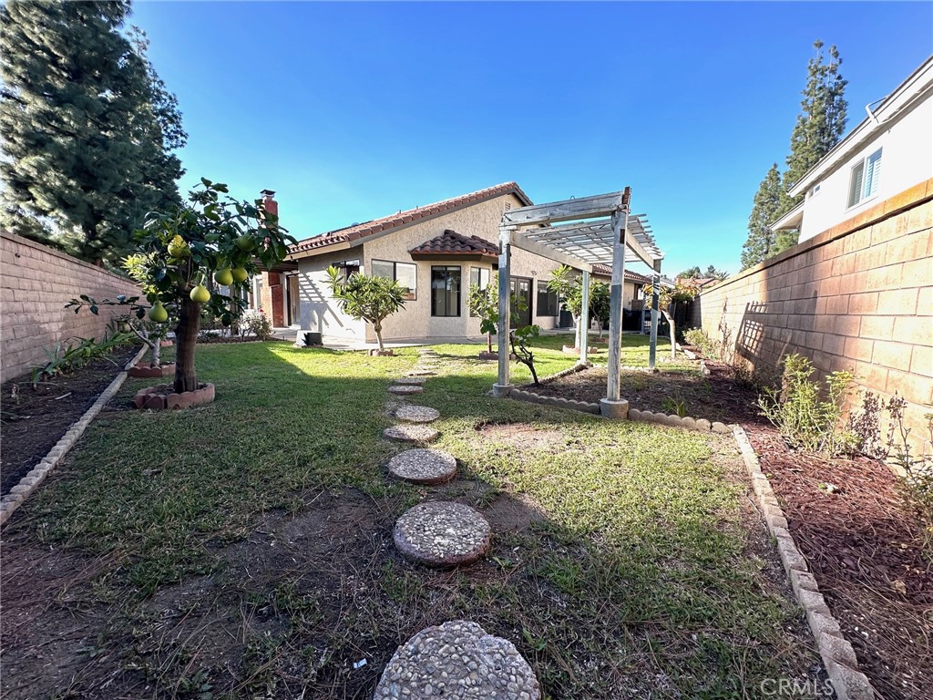 183 South Starflower Street Brea, CA 92821 - Photo 32 of 42 a front view of a house with garden