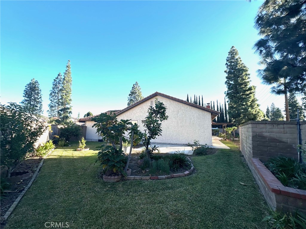 183 South Starflower Street Brea, CA 92821 - Photo 37 of 42 a view of a house with backyard and sitting area