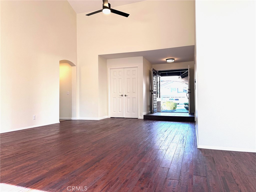 183 South Starflower Street Brea, CA 92821 - Photo 7 of 42 an empty room with wooden floor and windows