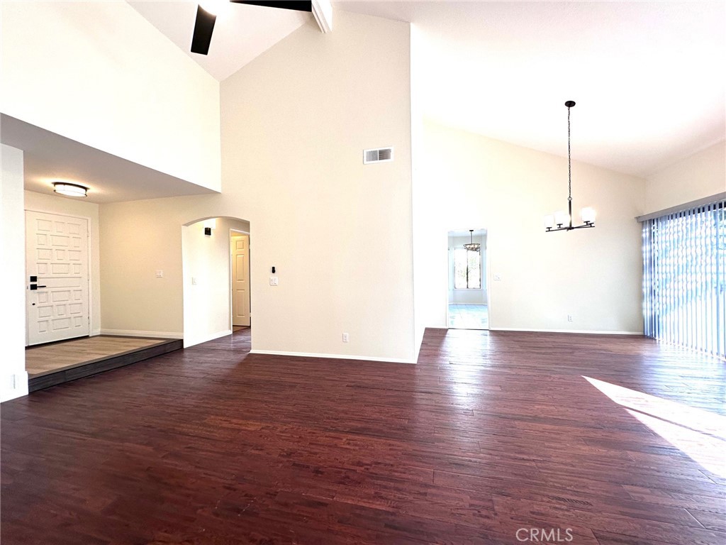 183 South Starflower Street Brea, CA 92821 - Photo 8 of 42 an empty room with wooden floor and windows