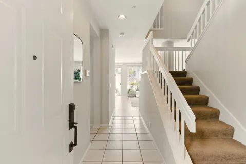 a view of entryway with furniture and wooden floor