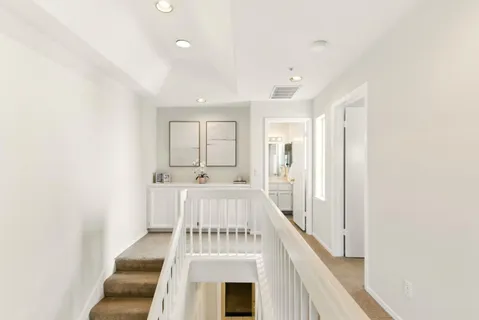 a view of a kitchen with a sink and cabinets