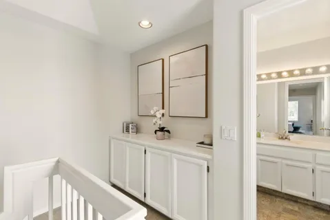 a bathroom with a double vanity sink mirror and