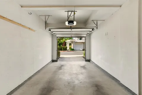 a view of entryway and hall with a front door