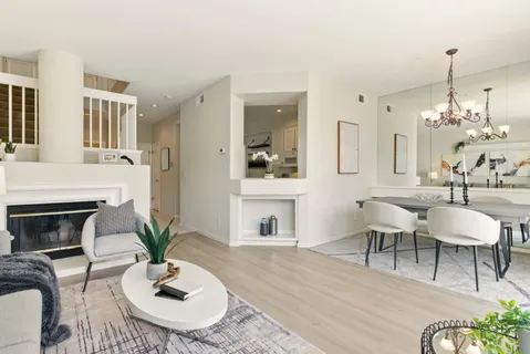 a dining room with furniture a livingroom and chandelier