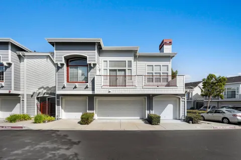 a front view of a house with parking