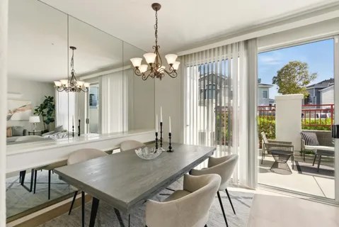 a view of a dining room with furniture wooden floor and chandelier