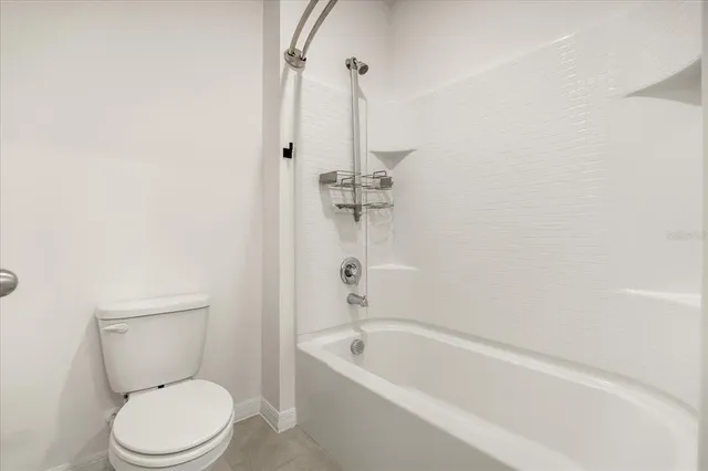 a bathroom with a toilet a sink and a bathtub
