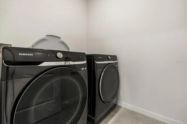 a utility room with dryer and washer