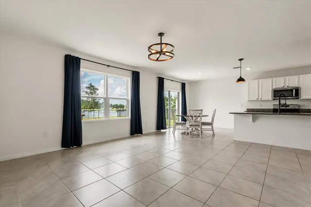a view of kitchen with furniture and window