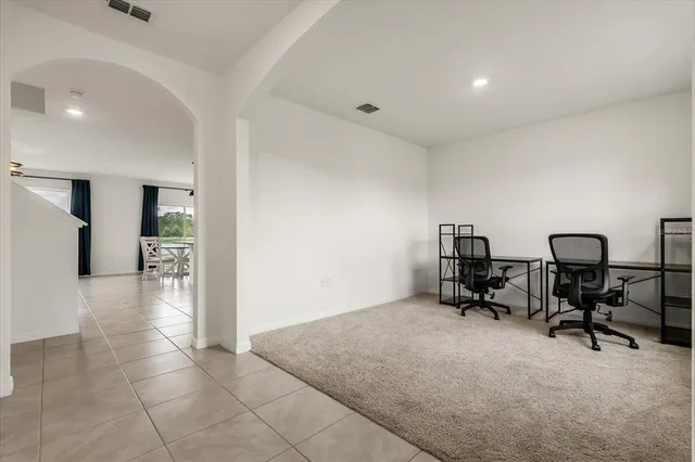 a view of a livingroom with workspace and a couch