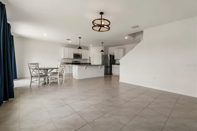 a view of a kitchen and dining room