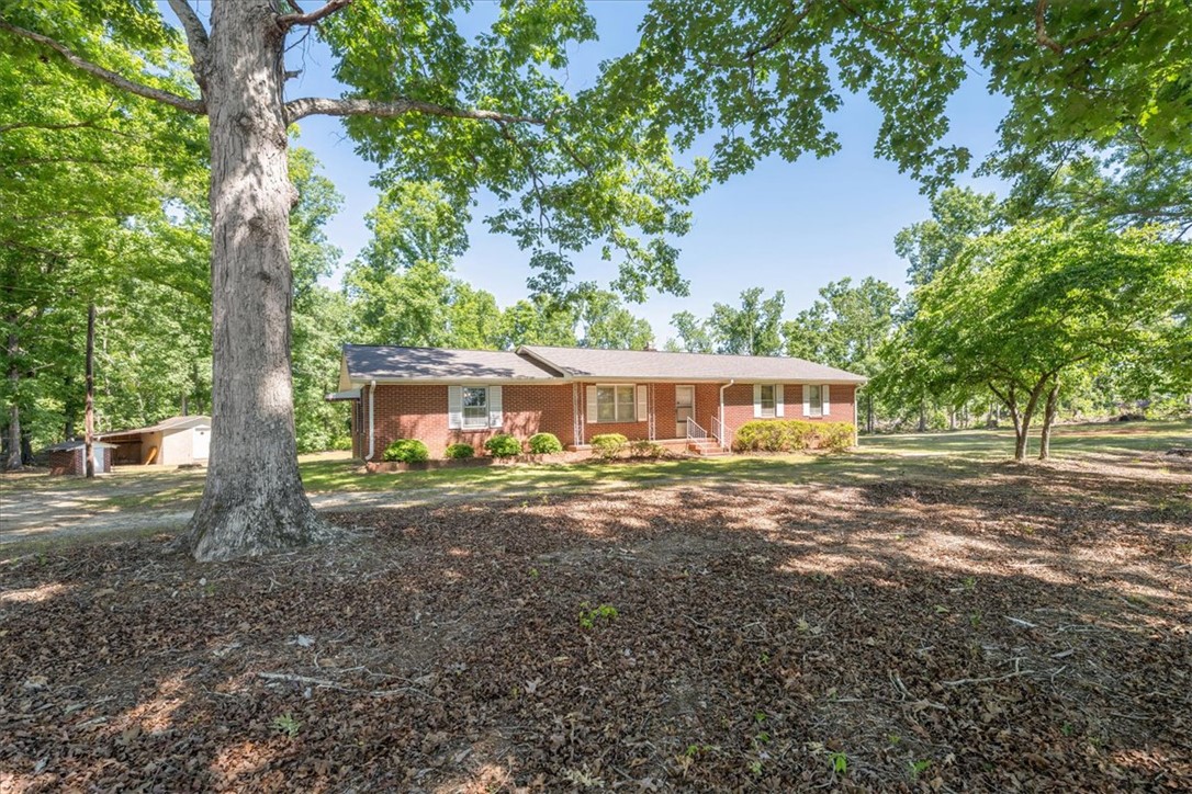 304 Shaw Road Honea Path, SC 29654 - Photo 2 of 39 This classic brick ranch home sits on a spacious, tree-lined lot.