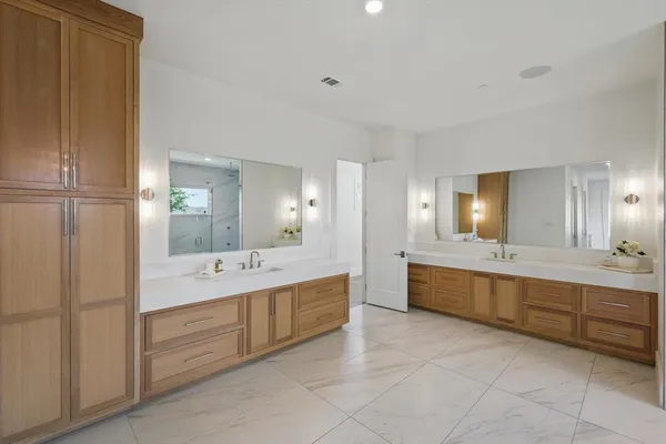 a large bathroom with a large tub sink and vanity