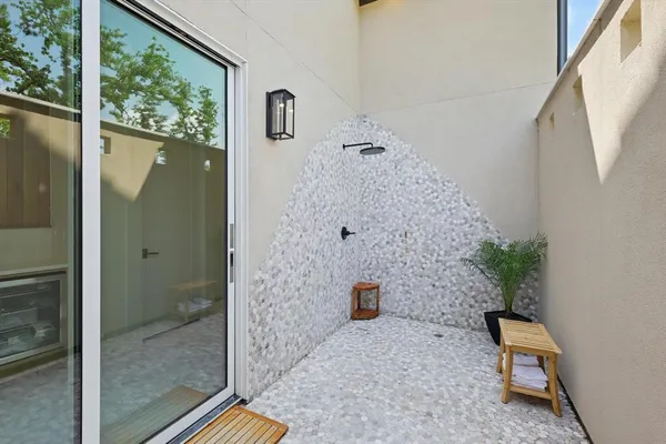 a view of bathroom with a shower and toilet